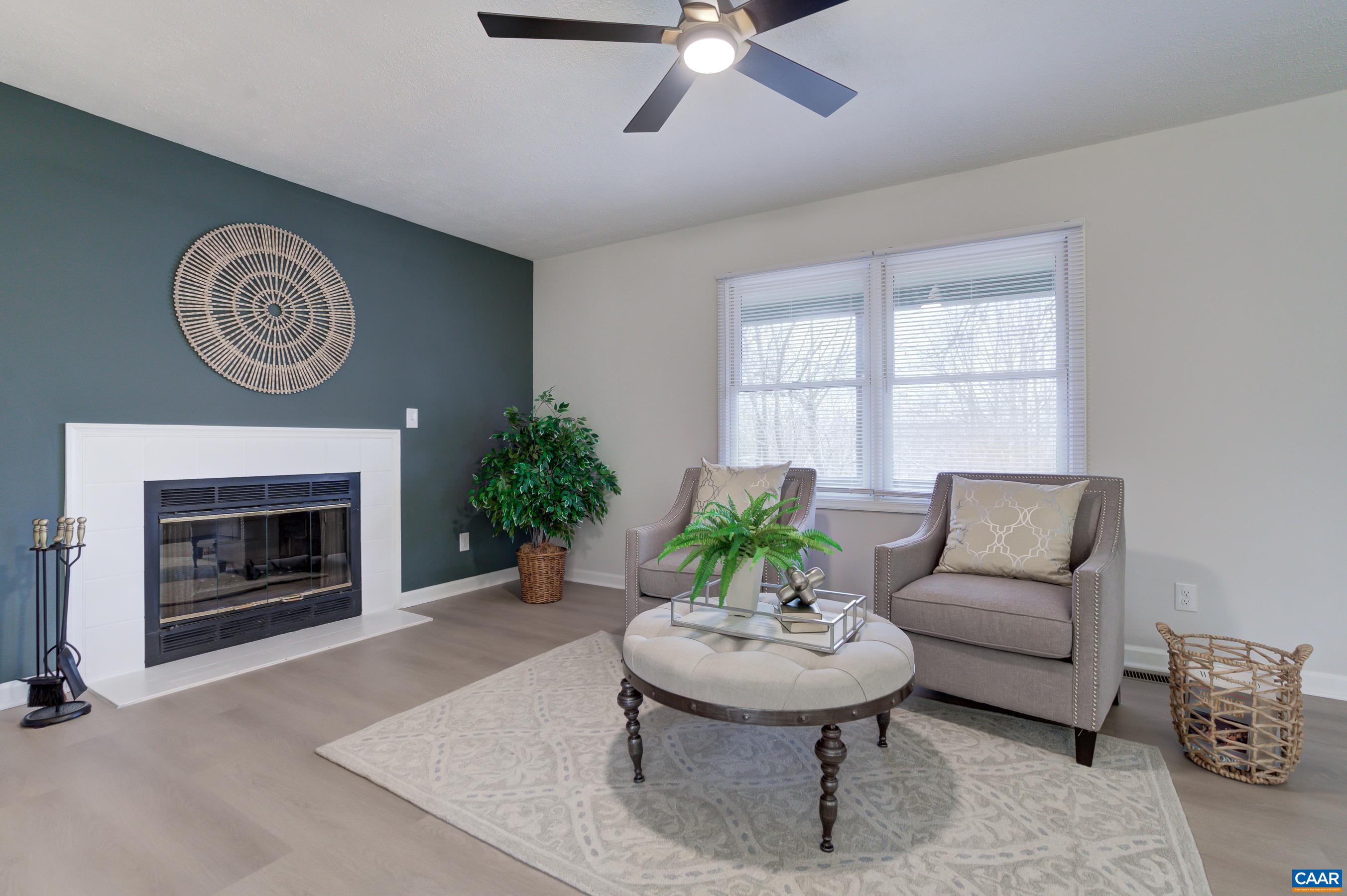 5582 Brookwood Road Crozet, VA 22932 - Photo 10 of 61 a living room with furniture and a fireplace