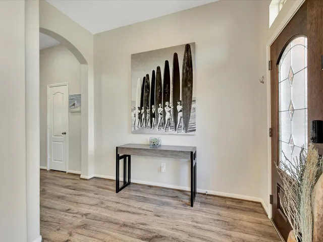 a view of an entryway with wooden floor
