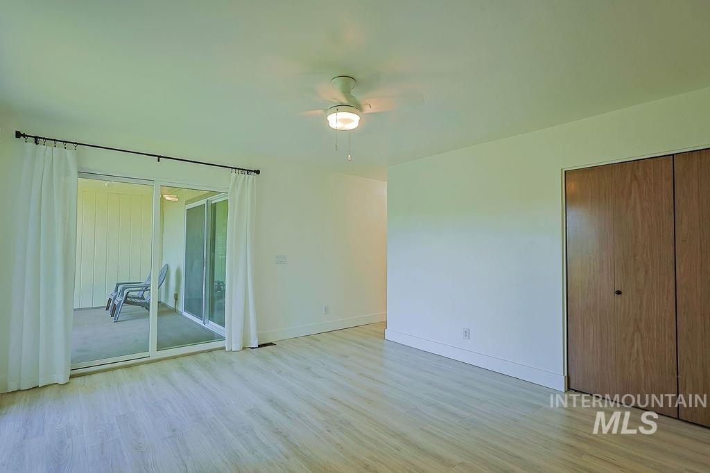640 Morrison Street Twin Falls, ID 83301 - Photo 18 of 30 Interior room featuring light wood-finish flooring, white walls, and a ceiling fan with integrated lighting