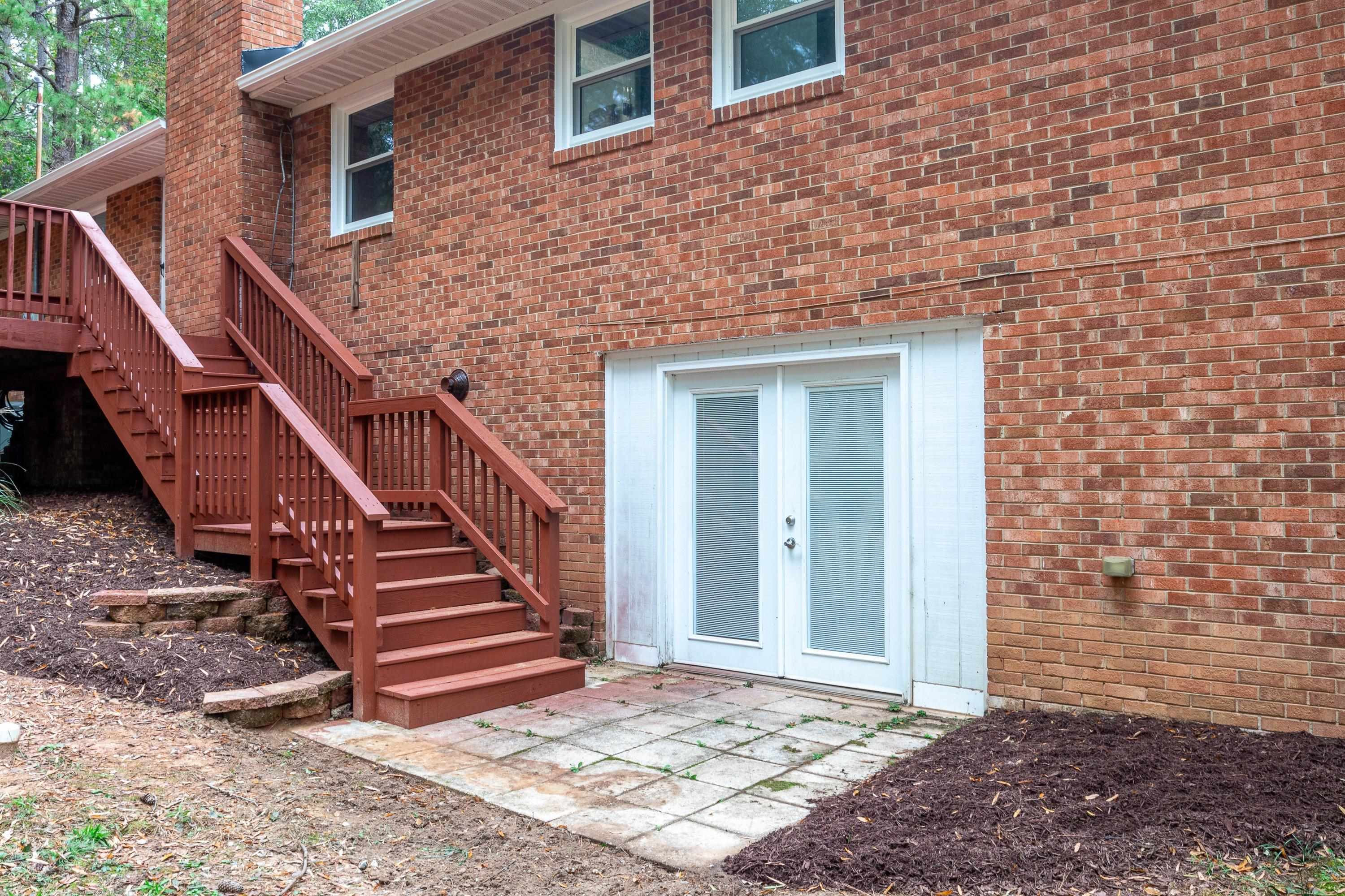 252 Hester Road Durham, NC 27703 - Photo 19 of 55 Lower Level rec/bonus room, storage and sealed crawlspace access.