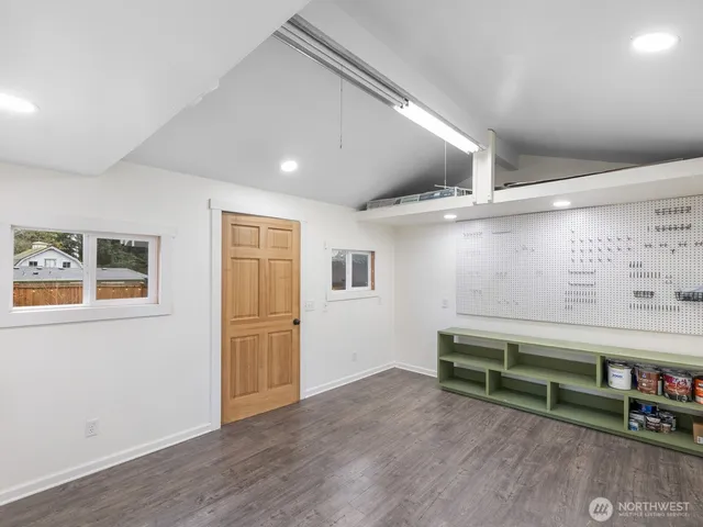 a view of room with window and wooden floor