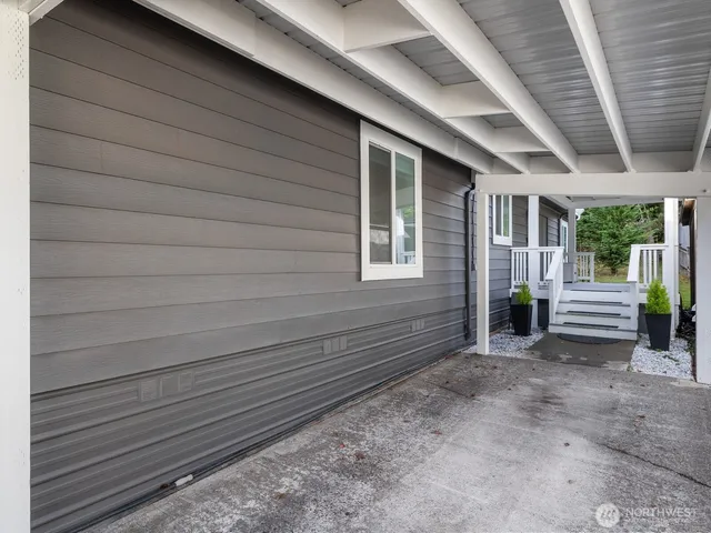 a view of a house with a backyard
