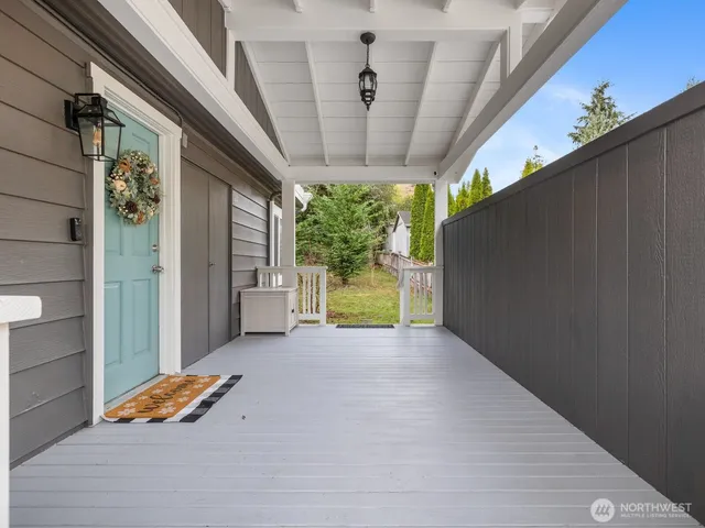 a view of a building with porch and garden