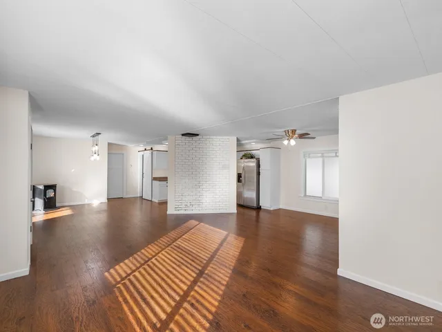 a view of a livingroom with wooden floor