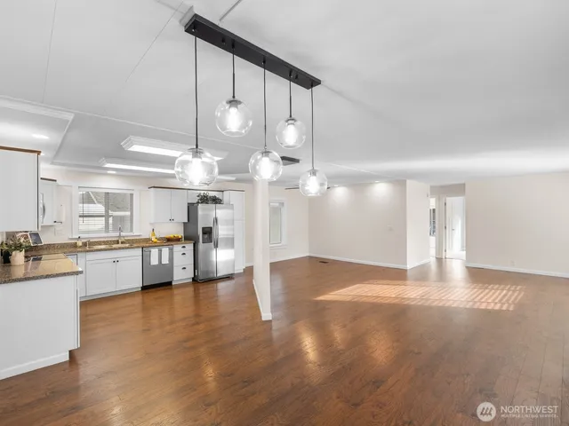 a view of a kitchen with a sink and cabinets