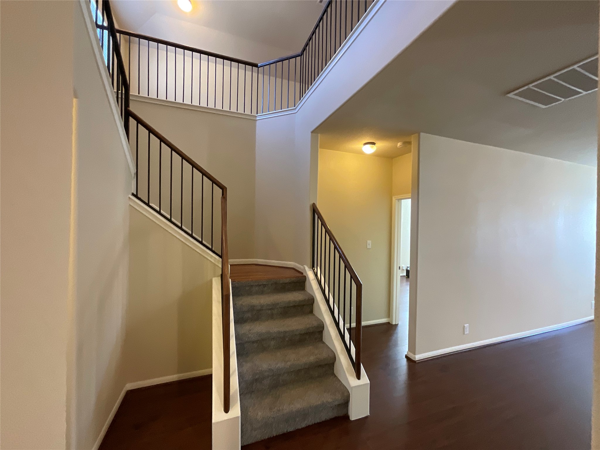 1911 Conn Creek Road Cedar Park, TX 78613 - Photo 9 of 39 a view of a hallway with wooden floor and staircase