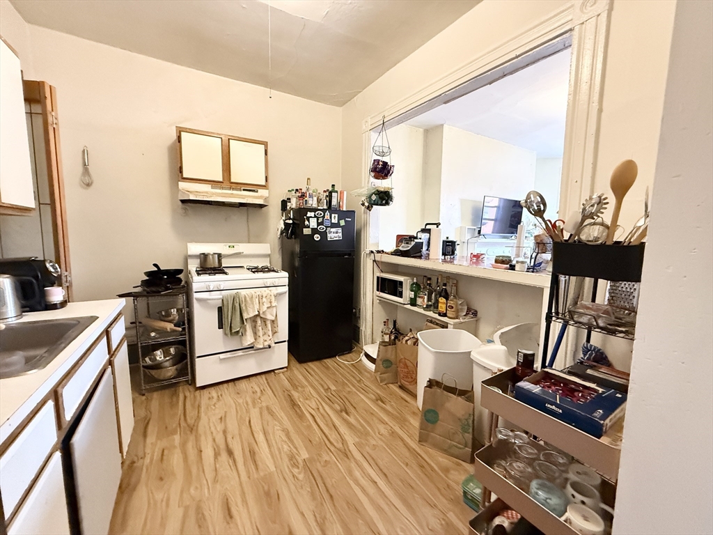 26 Symphony Road, Unit 4 Boston, MA 02115 - Photo 2 of 7 a kitchen with a sink appliances and cabinets