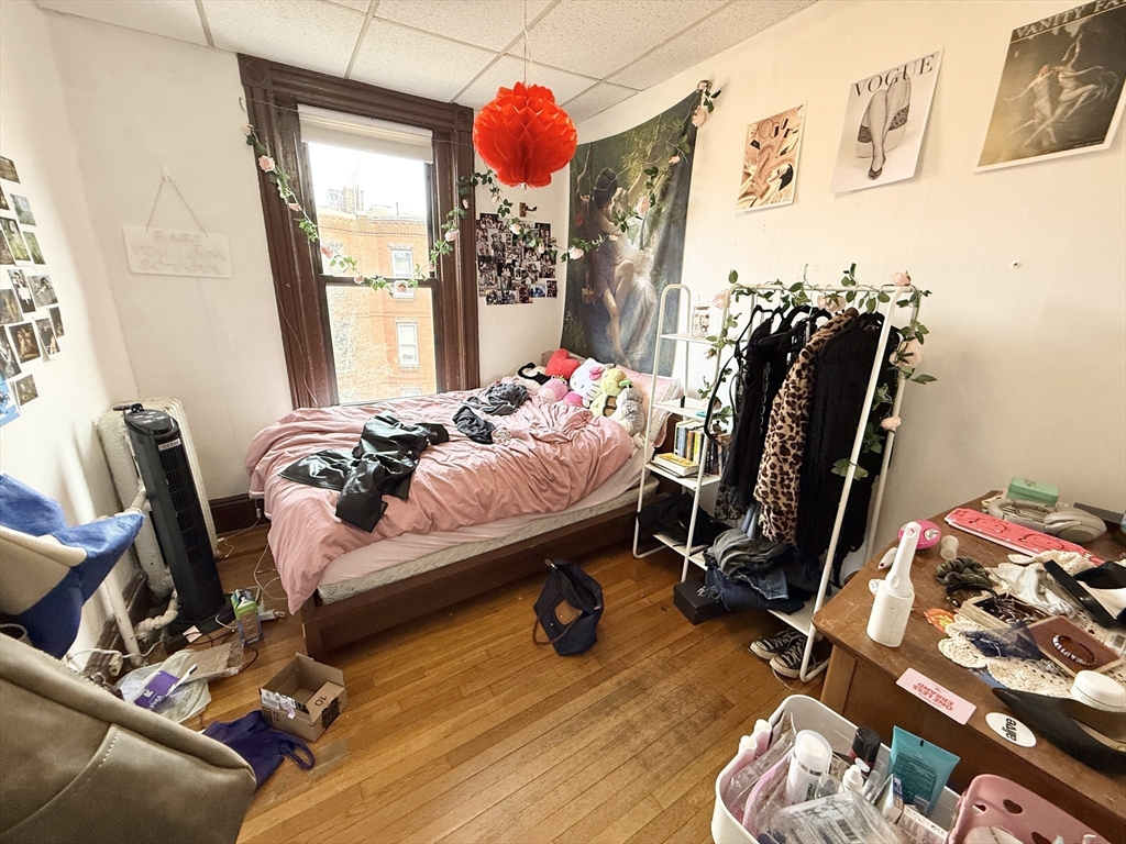 26 Symphony Road, Unit 4 Boston, MA 02115 - Photo 4 of 7 a bedroom with furniture and a window