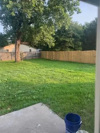 a backyard of a house with lots of green space