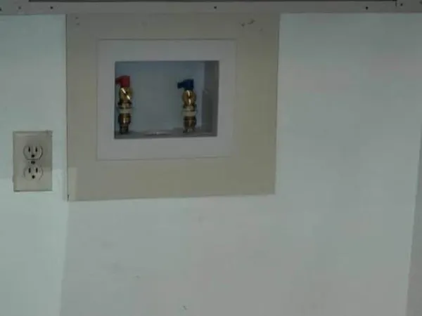 a kitchen with granite countertop a sink stove and cabinets