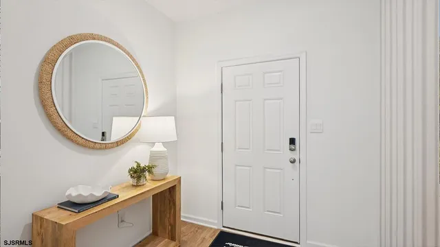 a bathroom with a toilet and a mirror
