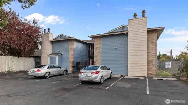 a white car parked in front of a house