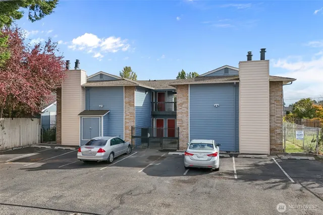 a front view of a house with parking space