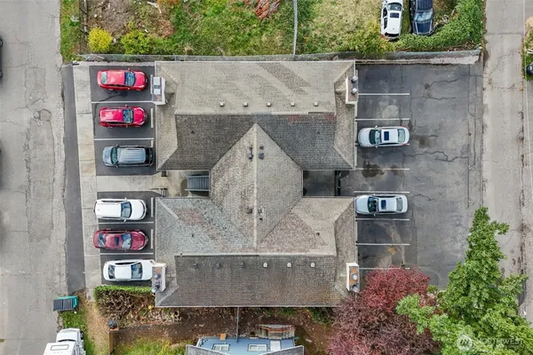 an aerial view of houses with outdoor space