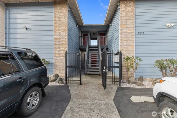 a view of a car parked front of a house