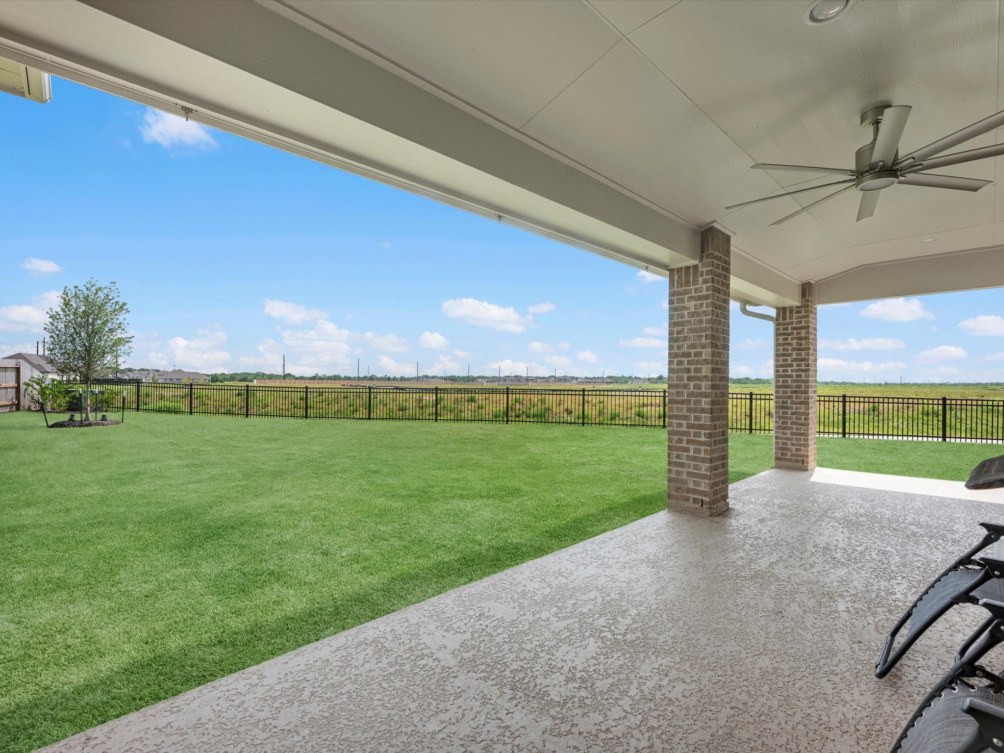 18714 Pistachio Way Manvel, TX 77578 - Photo 39 of 48 Relax beneath the extended covered patio while enjoying the privacy of no rear neighbors and a spacious backyard with plenty of room to play, entertain, or simply unwind.
