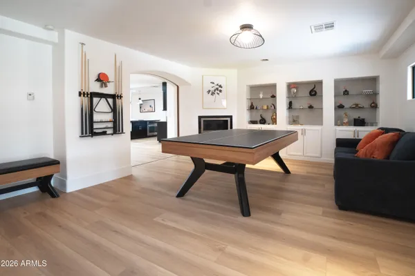 a large kitchen with a table and chairs in it