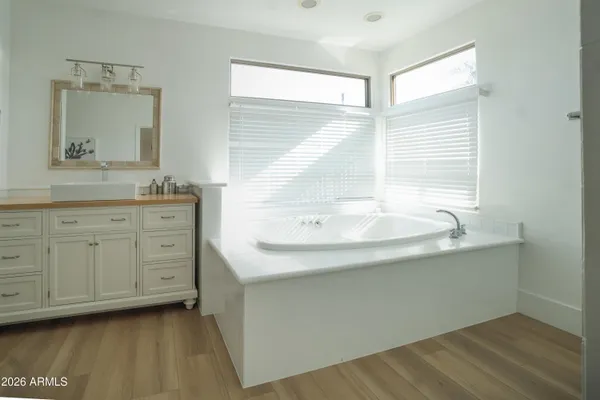 a bathroom with a bathtub and a shower