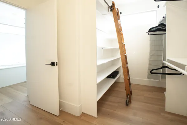 a view of a bathroom with sink and mirror