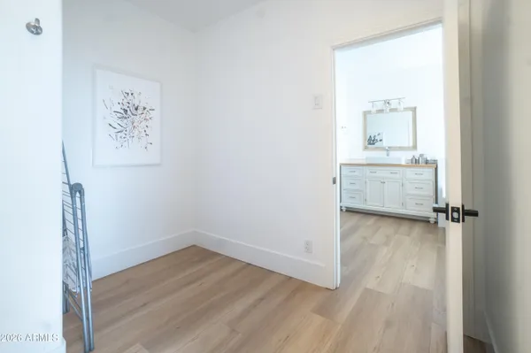 a bathroom with a glass shower door