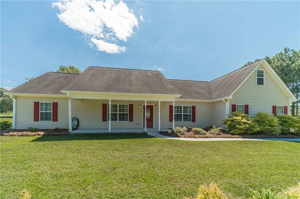 1725 Double Bridges Road Monroe, GA 30655 - Photo 1 of 1 a front view of house with yard and outdoor seating
