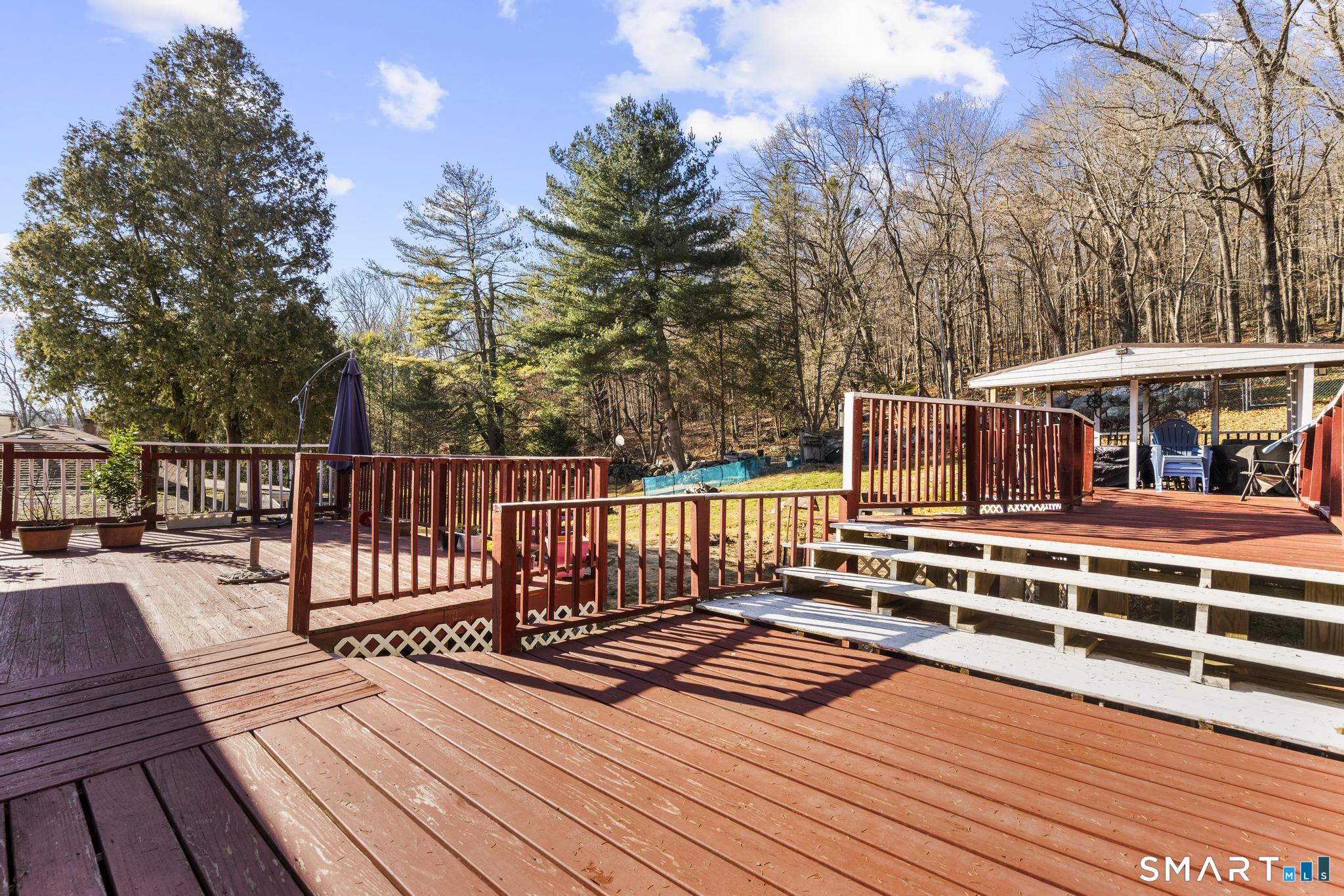 208 Bungay Road Seymour, CT 06483 - Photo 20 of 24 a view of a roof deck with wooden floor and fence