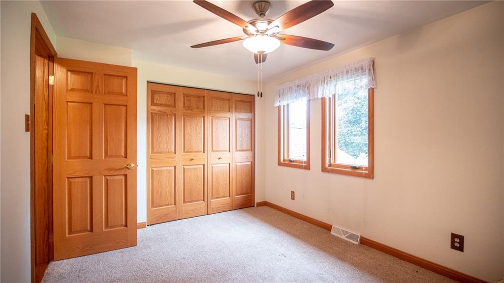 141 Singleton Road Sarver, PA 16055 - Photo 11 of 23 an empty room with windows and fan