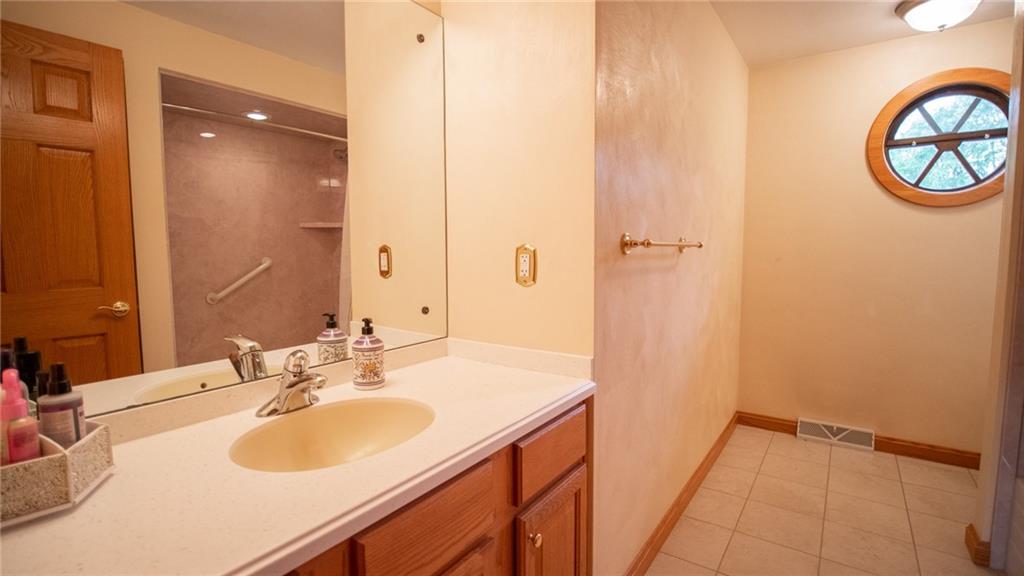 141 Singleton Road Sarver, PA 16055 - Photo 15 of 23 a bathroom with a sink and a mirror