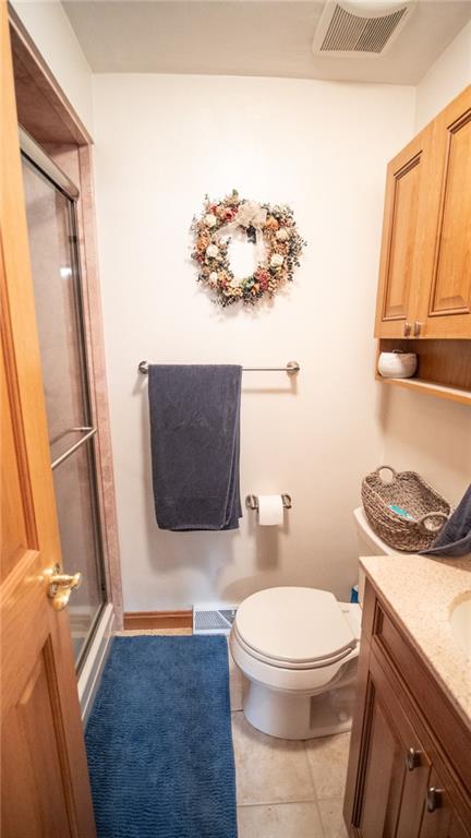 141 Singleton Road Sarver, PA 16055 - Photo 20 of 23 a bathroom with a toilet a sink and a mirror