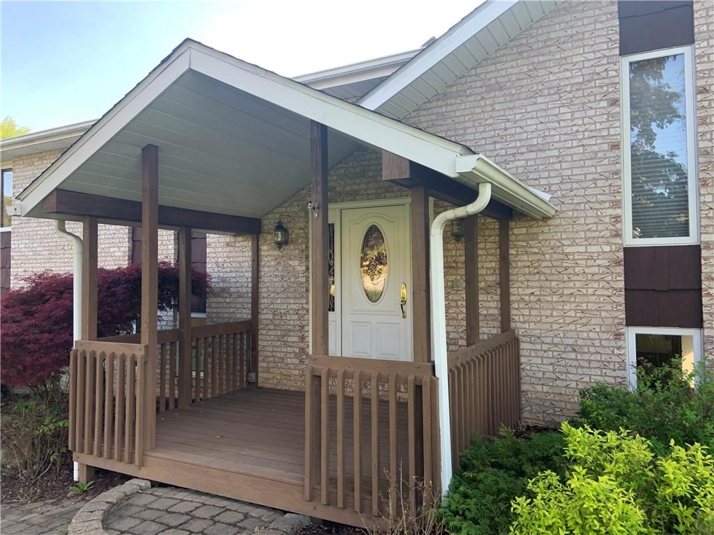 141 Singleton Road Sarver, PA 16055 - Photo 2 of 23 a front view of a house with glass door