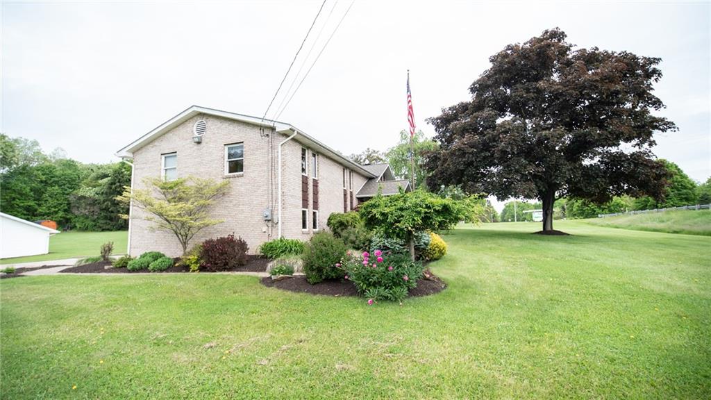 141 Singleton Road Sarver, PA 16055 - Photo 21 of 23 a view of a house with a backyard