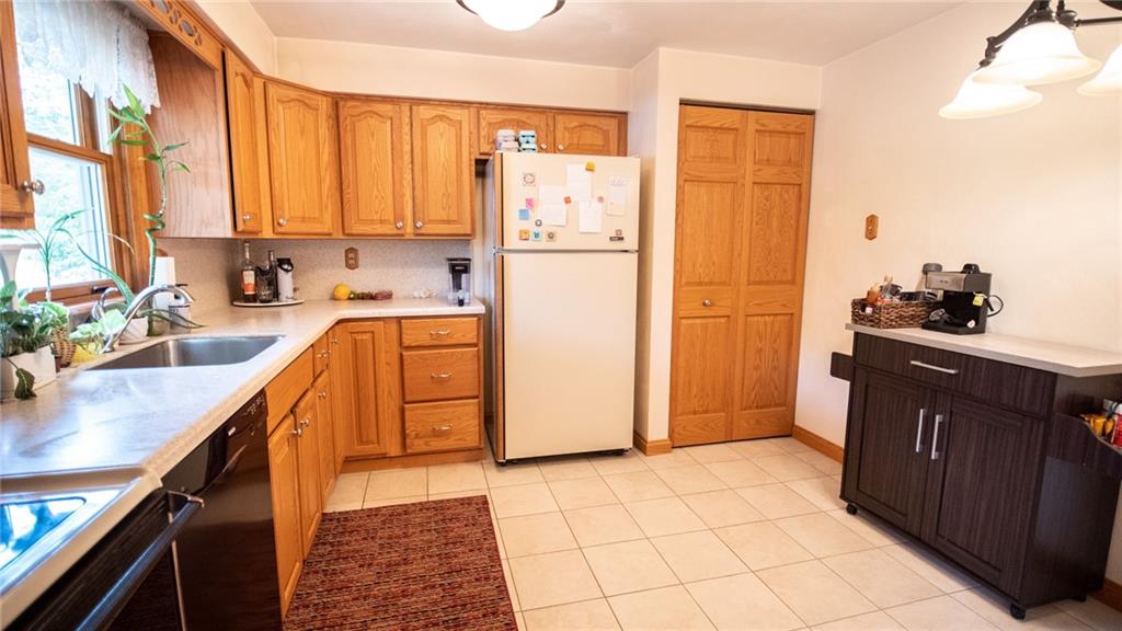 141 Singleton Road Sarver, PA 16055 - Photo 7 of 23 a kitchen with stainless steel appliances a refrigerator sink and cabinets