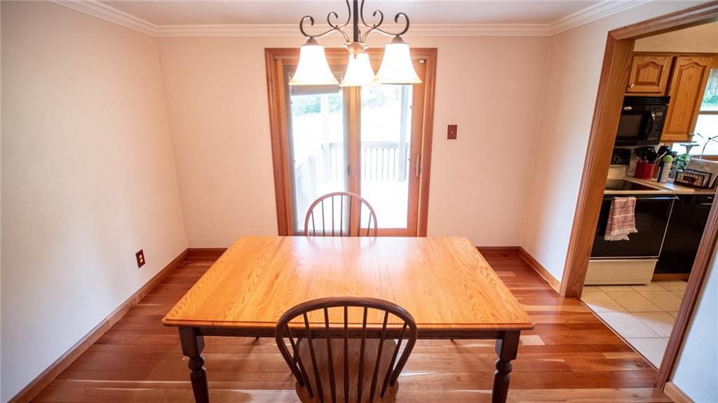 141 Singleton Road Sarver, PA 16055 - Photo 8 of 23 a view of a dining room with furniture window and wooden floor