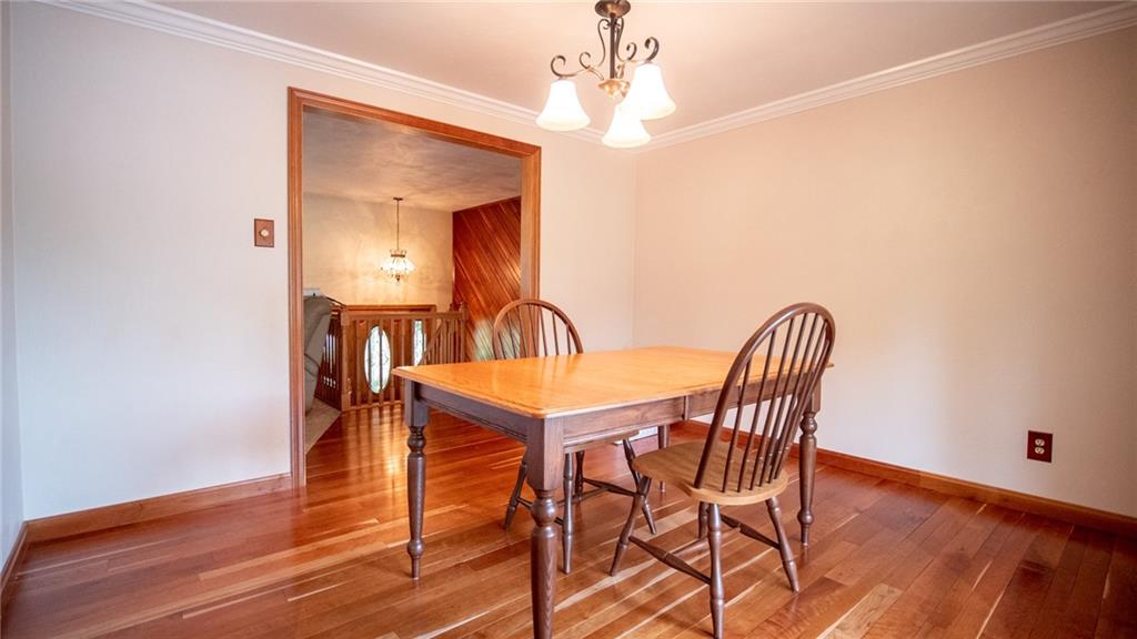 141 Singleton Road Sarver, PA 16055 - Photo 9 of 23 a view of a dining room with furniture and wooden floor