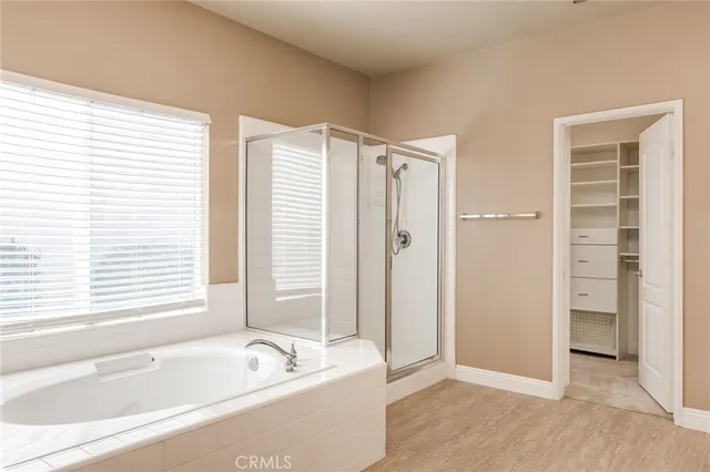a bathroom with a bathtub and a shower
