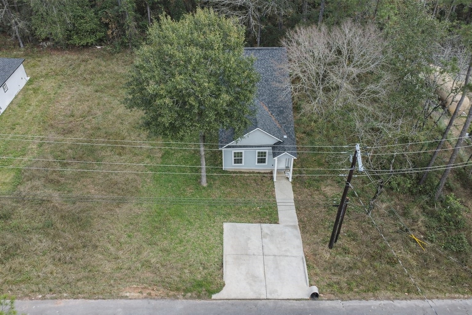 15514 Hickory Drive Montgomery, TX 77356 - Photo 16 of 26 a view of a wooden door and a yard