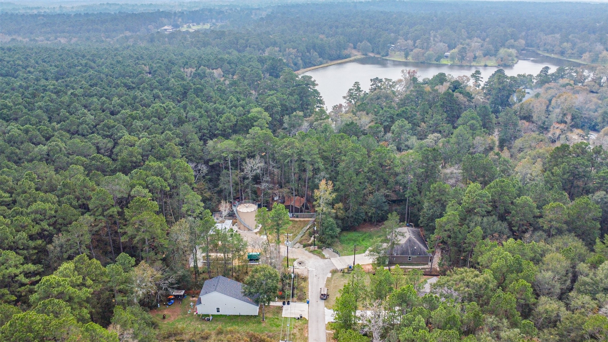 15514 Hickory Drive Montgomery, TX 77356 - Photo 21 of 26 an aerial view of residential house with outdoor space and trees all around