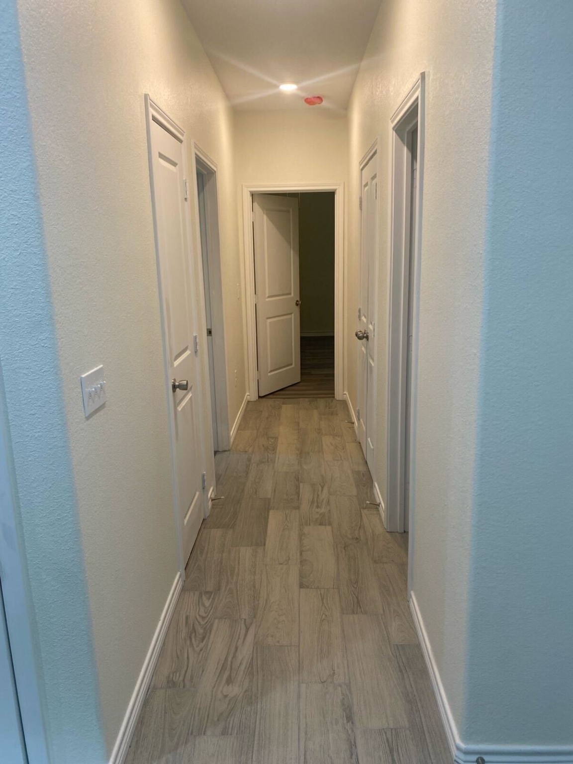 15514 Hickory Drive Montgomery, TX 77356 - Photo 8 of 26 a view of a hallway with wooden floor