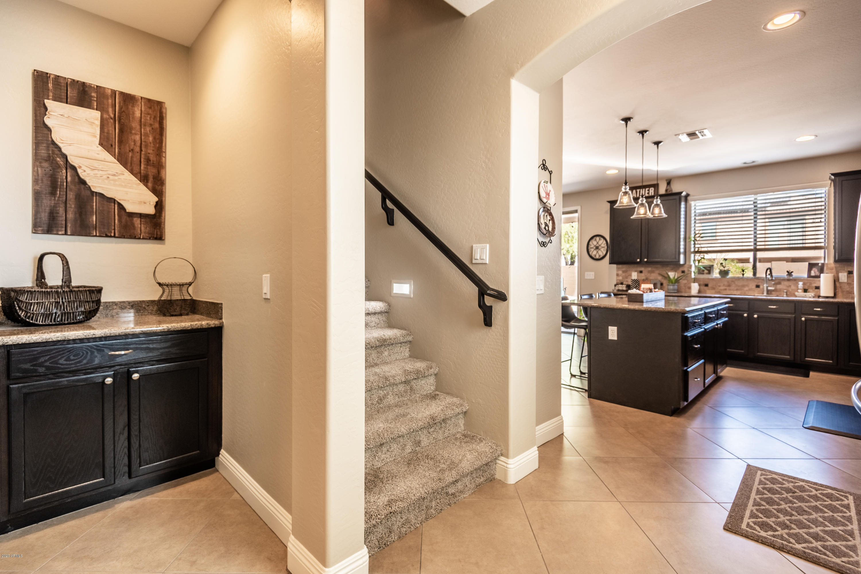 13628 West Calavar Road Surprise, AZ 85379 - Photo 17 of 48 a view of kitchen with a sink and a refrigerator