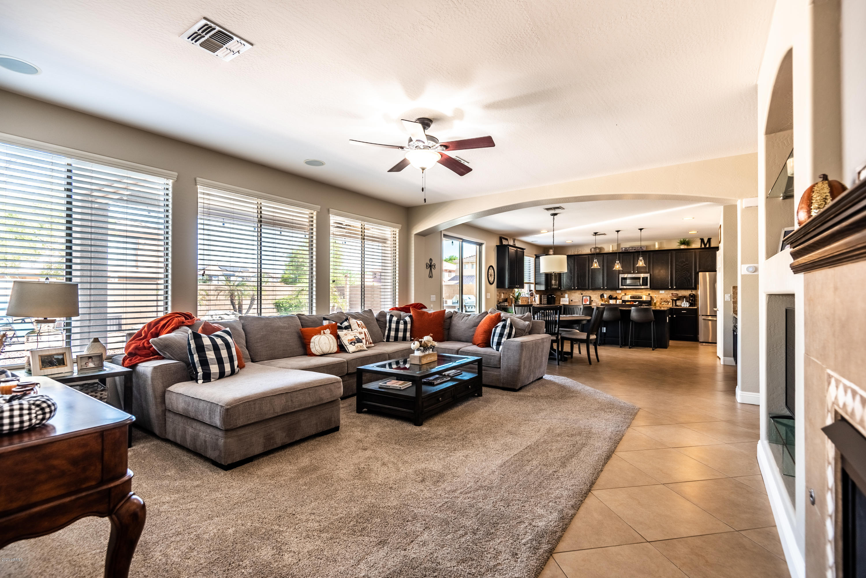 13628 West Calavar Road Surprise, AZ 85379 - Photo 18 of 48 a living room with furniture and a large window