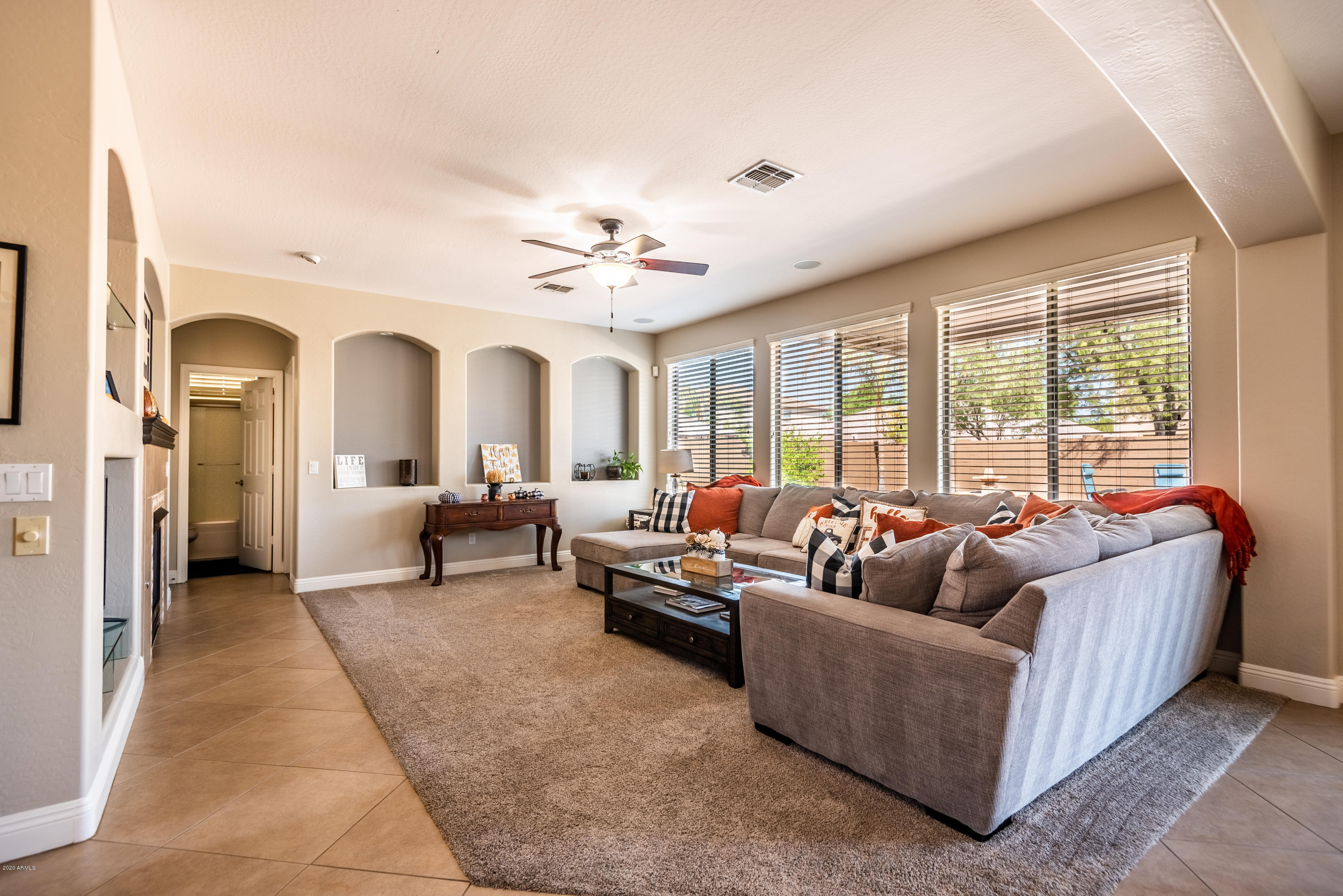 13628 West Calavar Road Surprise, AZ 85379 - Photo 19 of 48 a living room with furniture and a large window