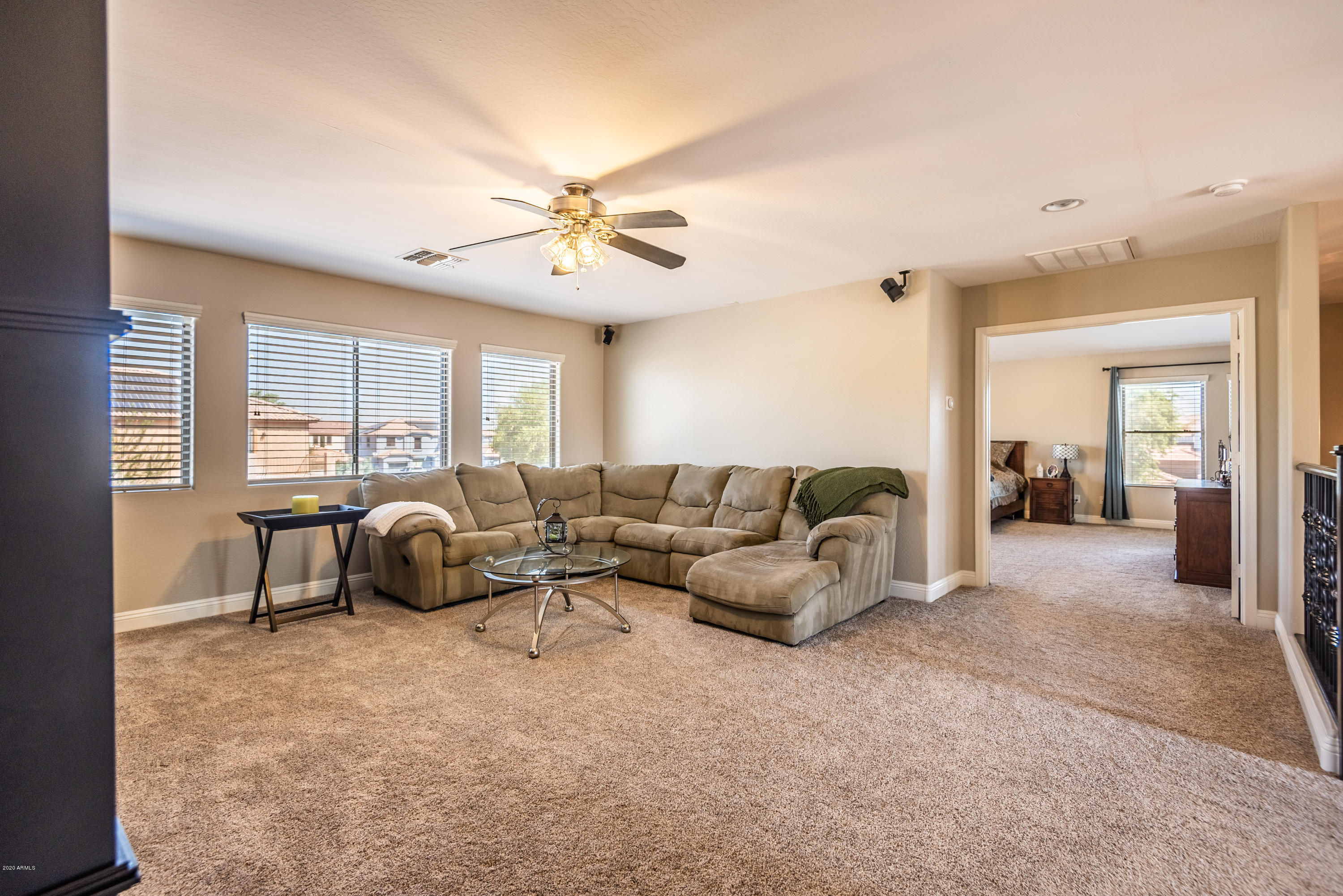 13628 West Calavar Road Surprise, AZ 85379 - Photo 25 of 48 a living room with furniture and a large window