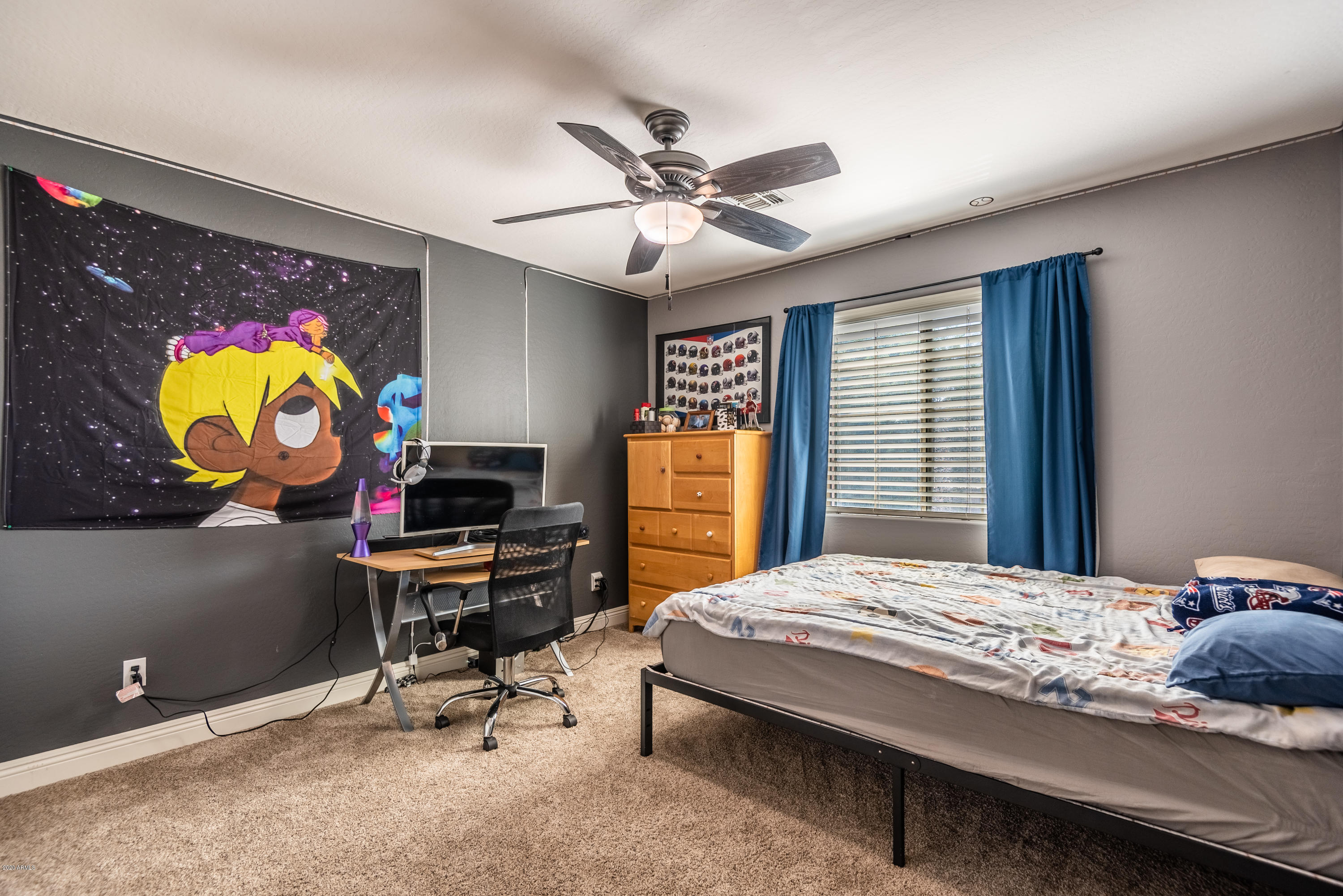13628 West Calavar Road Surprise, AZ 85379 - Photo 34 of 48 a bedroom with a bed and a desk