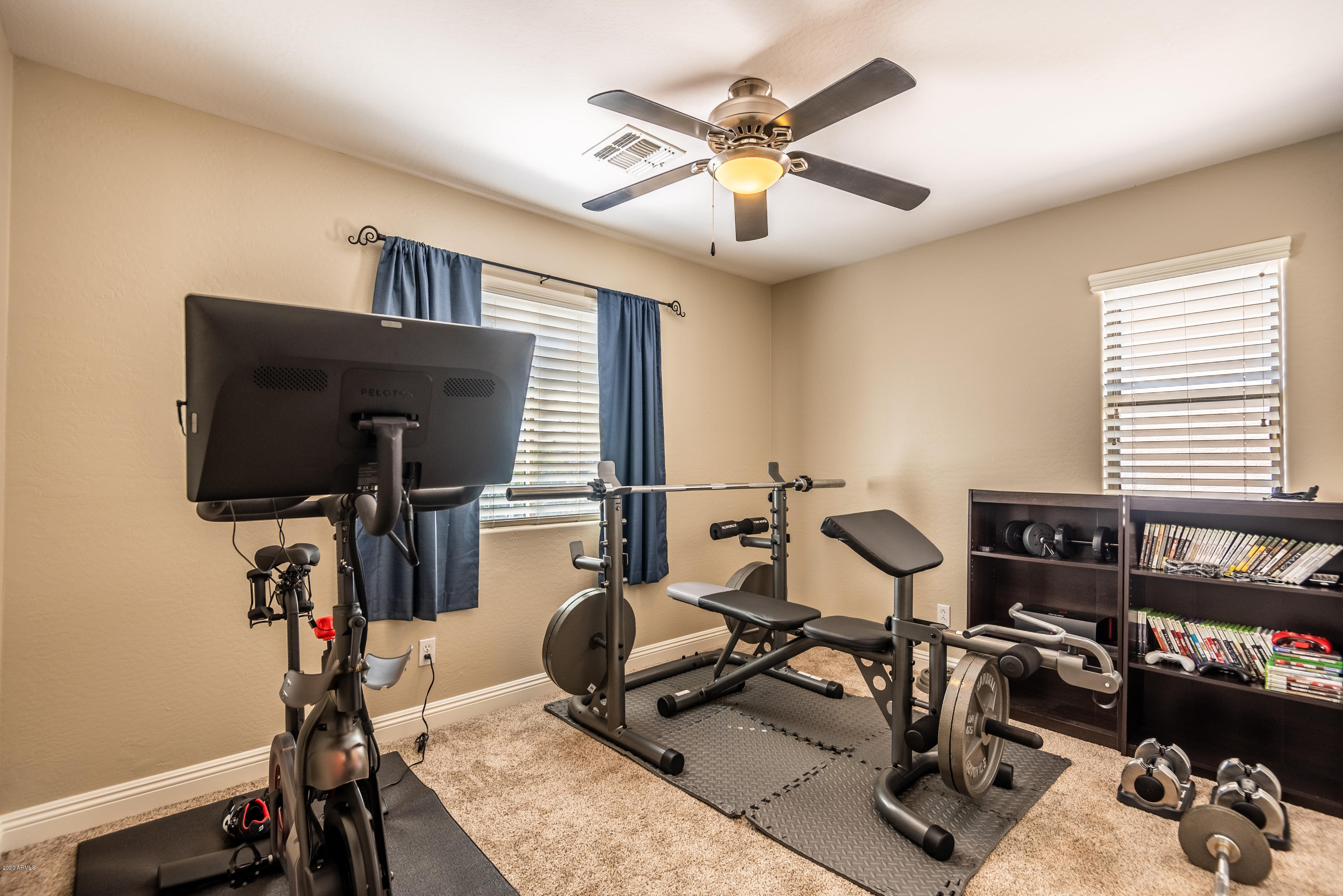 13628 West Calavar Road Surprise, AZ 85379 - Photo 37 of 48 a view of a room with gym equipment
