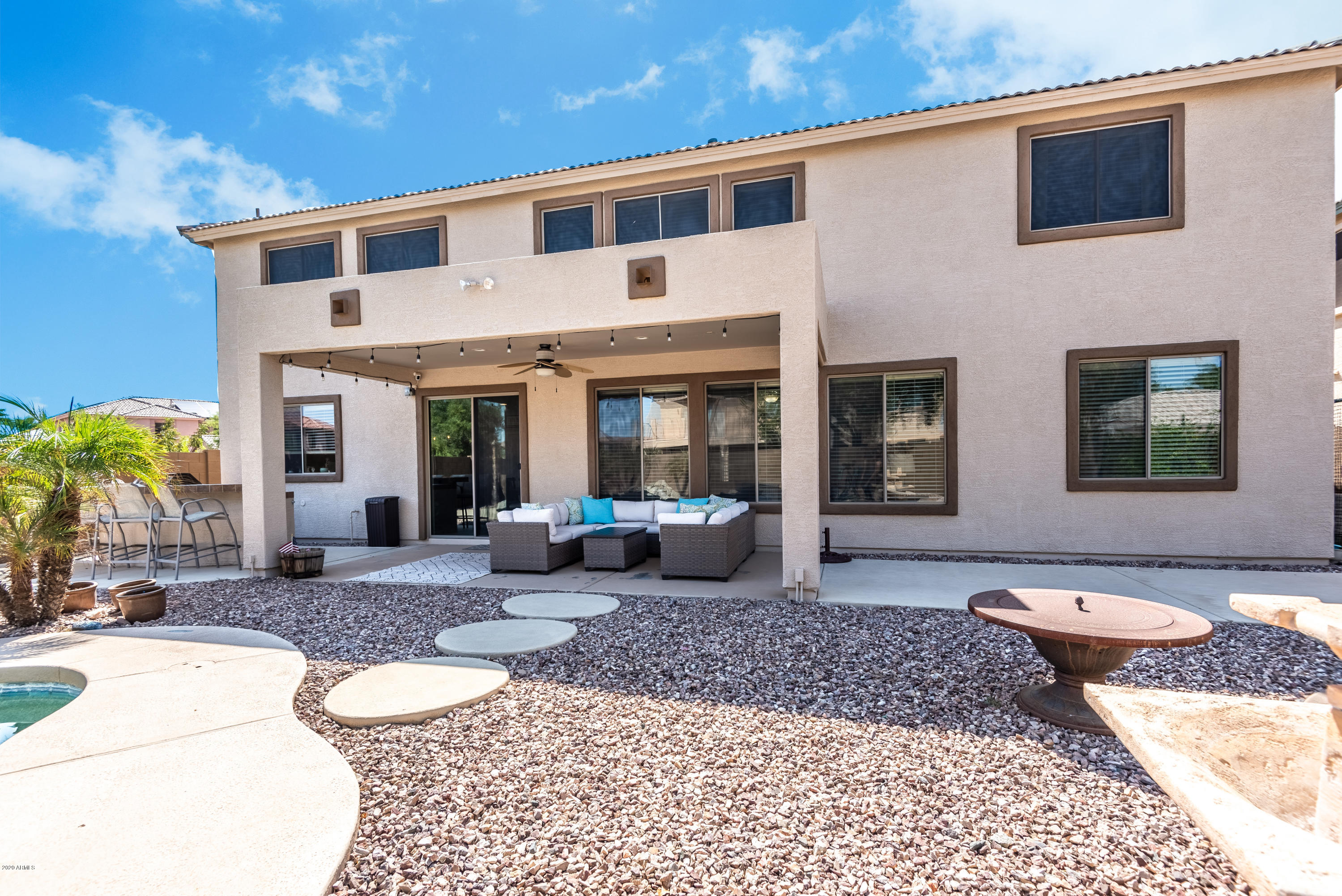 13628 West Calavar Road Surprise, AZ 85379 - Photo 43 of 48 a front view of a house with garden