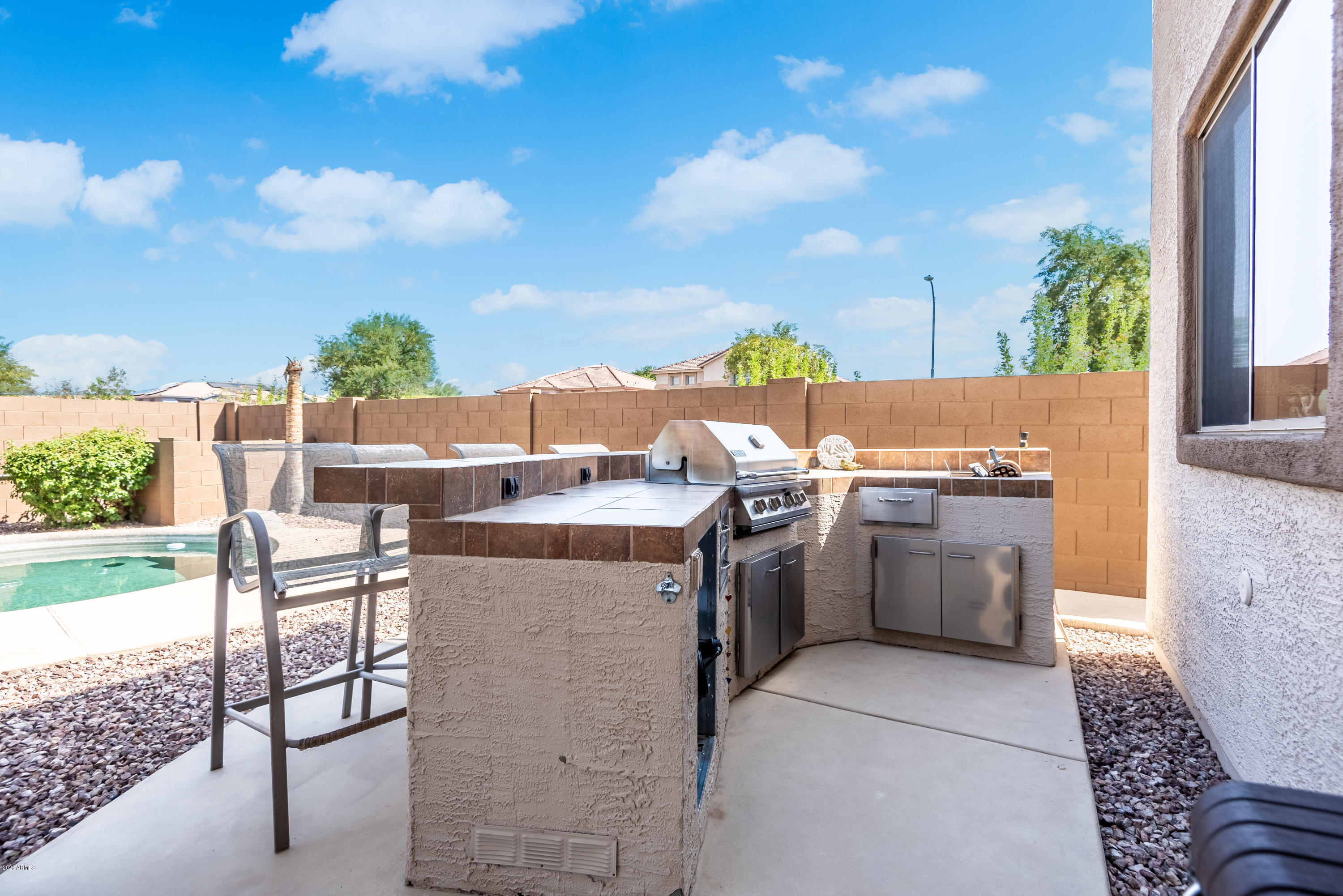 13628 West Calavar Road Surprise, AZ 85379 - Photo 48 of 48 a view of a kitchen with outdoor kitchen