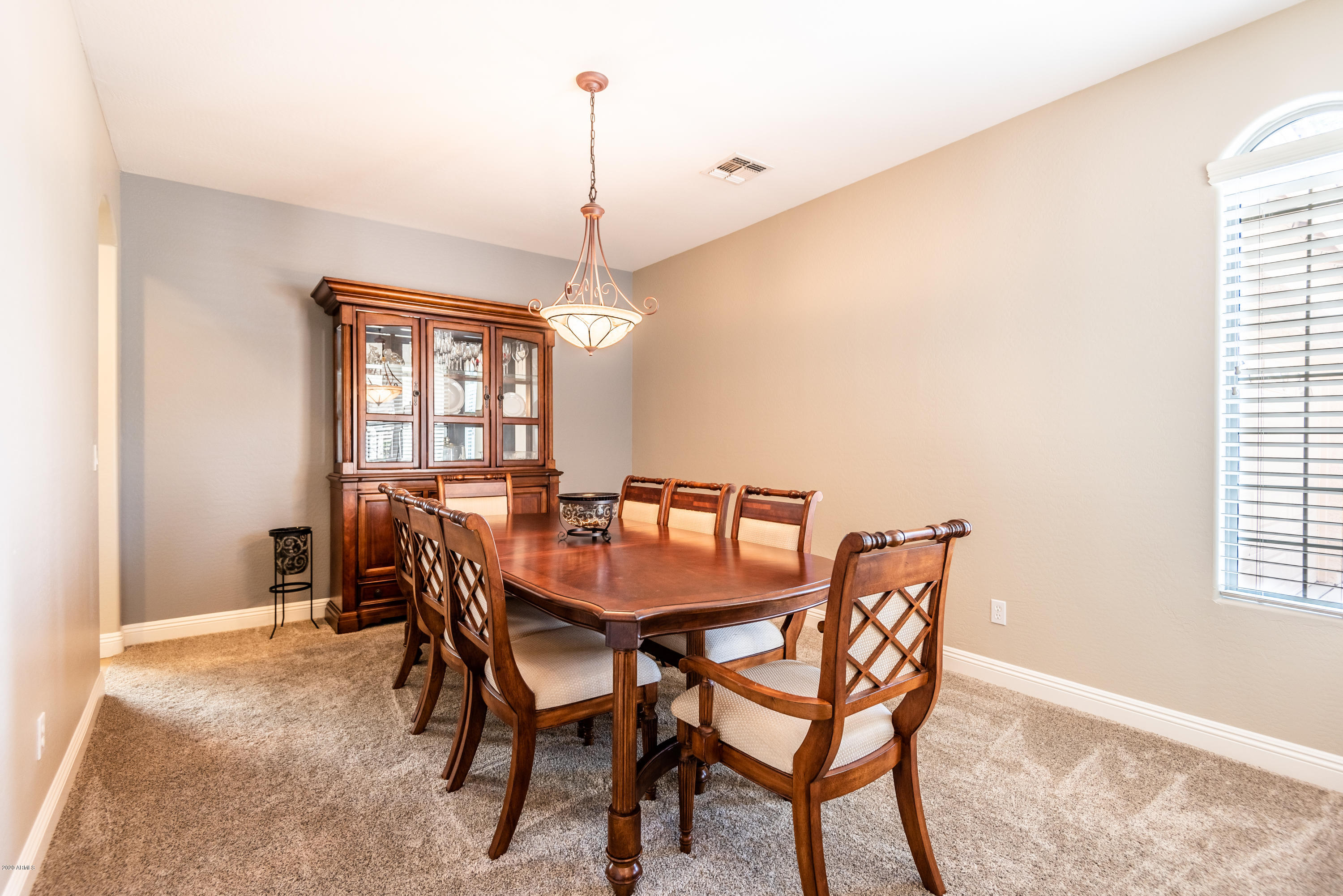 13628 West Calavar Road Surprise, AZ 85379 - Photo 8 of 48 a view of a dining room with furniture and window