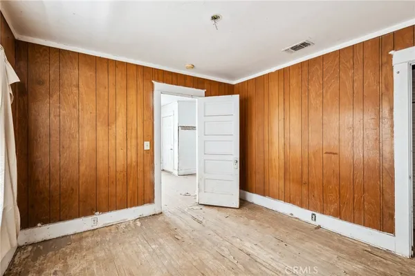 an empty room with closet area