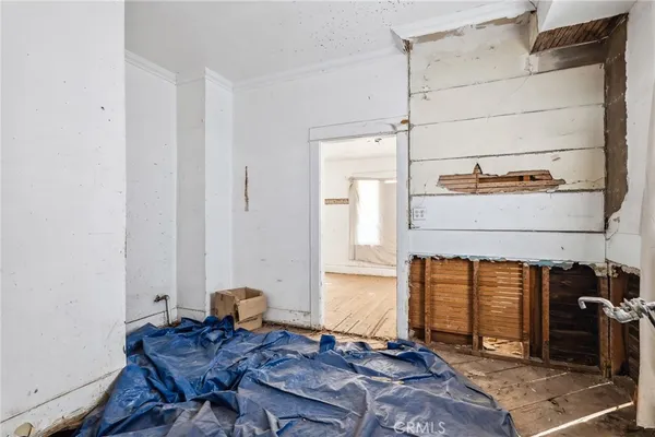 a bed room with a bed and dresser