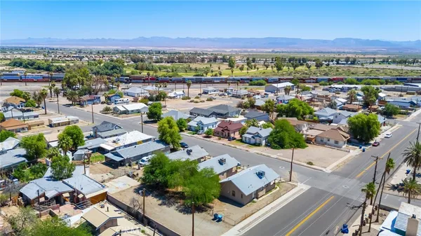 an aerial view of residential houses with outdoor space